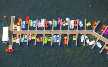 Aerial view, colourful pedal boats at a jetty on the Unterbacher See at the campsite north,