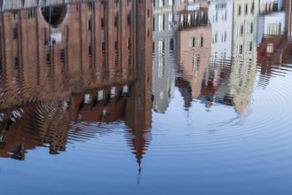 Waterfront promenade with reflection at sunrise in the Old Town, Motlawa River, Gdansk, Gdansk,