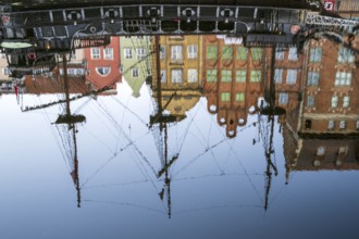 Waterfront promenade with reflection at sunrise in the Old Town, Motlawa River, Gdansk, Gdansk,
