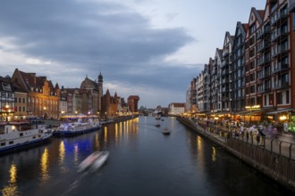 Illuminated promenade at sunset in the Old Town, Motlawa River, Gdansk, Poland