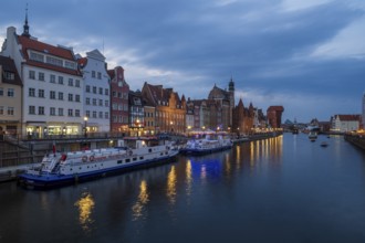 Illuminated promenade at sunset in the Old Town, Motlawa River, Gdansk, Poland