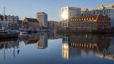 Waterfront promenade with reflection at sunrise in the Old Town, Motlawa River, Gdansk, Gdansk,