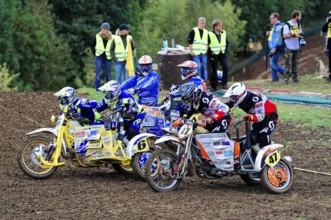 Motocross, Rudersberg, Baden-Württemberg, Germany, Europe, Several motocross riders in colourful