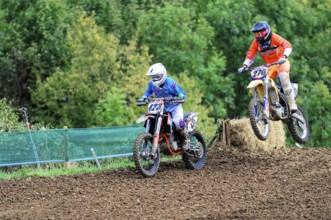 Motocross, Rudersberg, Baden-Württemberg, Germany, Europe, Two motocross riders during a jump over