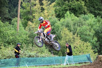 Motocross, Rudersberg, Baden-Württemberg, Germany, Europe, A rider in red protective clothing jumps