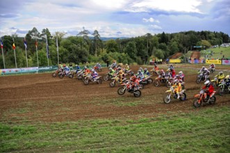 Motocross, Rudersberg, Baden-Württemberg, Germany, Europe, Motocross riders accelerate after the