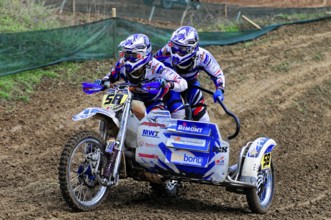 Motocross, Rudersberg, Baden-Württemberg, Germany, Europe, Two riders travelling fast over a muddy