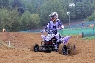 Motocross, Rudersberg, Baden-Württemberg, Germany, Europe, Quad bikers in purple colours on a race