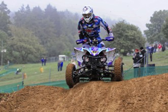Motocross, Rudersberg, Baden-Württemberg, Germany, Europe, quad bikers in a mud race on a hilly