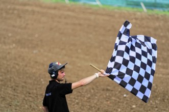 Motocross, Rudersberg, Baden-Württemberg, Germany, Europe, Man waving a black and white chequered