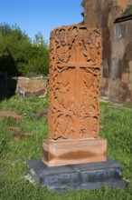 Decorated stone with cross motif in green surroundings, cross stone, Khachkar, Marmashen Monastery,