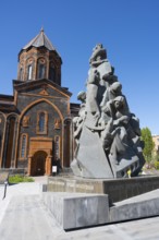 A stone monument in front of a church with classical architecture under a clear sky, Church of the