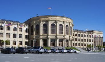 A large historic building with classical architecture under a clear sky, Gyumri City Hall, Gyumri,