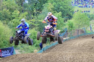 Motocross, Rudersberg, Baden-Württemberg, Germany, Europe, Two quads jump synchronised over a