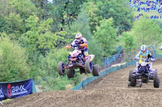 Motocross, Rudersberg, Baden-Württemberg, Germany, Europe, A quad bike rider jumps over a track