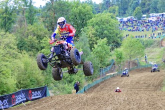 Motocross, Rudersberg, Baden-Württemberg, Germany, Europe, A quadbike drives in the air over a
