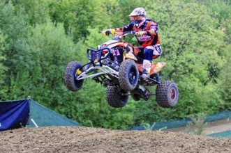 Motocross, Rudersberg, Baden-Württemberg, Germany, Europe, A quad bike rider takes off into the air