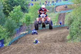 Motocross, Rudersberg, Baden-Württemberg, Germany, Europe, A quad bike rider jumps over a track