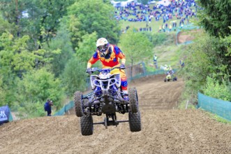 Motocross, Rudersberg, Baden-Württemberg, Germany, Europe, A quad bike rider jumps over a track,