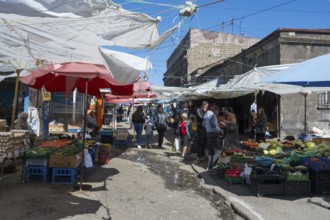 Lively outdoor market with many stalls and people under awnings, Gyumri, Giumri, Gyumri, Shirak
