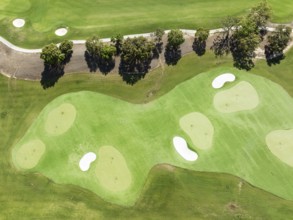 Driving range with greens and bunkers at the San Roque Club Golf Resort. Aerial view. Drone shot.