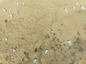 Fishing boats at low tide in the town of Cádiz. Aerial view. Drone shot. Cádiz province, Andalusia,