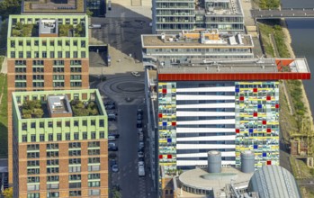 Aerial view, Colorium Hotel Innside Düsseldorf harbour and artistic coloured glass panel facade,