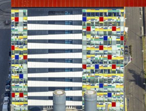 Aerial view, Colorium Hotel Innside Düsseldorf harbour and artistic coloured glass panel facade,