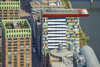 Aerial view, Colorium Hotel Innside Düsseldorf harbour and artistic coloured glass panel facade,