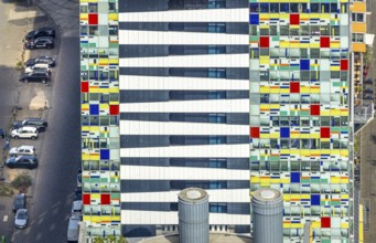 Aerial view, Colorium Hotel Innside Düsseldorf harbour and artistic coloured glass panel facade,