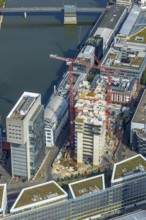 Aerial view, Media harbour on the river Rhine, construction site with construction crane and new