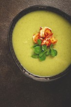 Pea cream soup, with shrimp, green soup, homemade, top view, no people