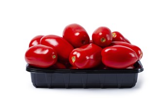Plum-shaped tomatoes, fresh, in a black plastic container, on a white background, isolate