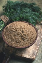 Dried dill, in a ceramic bowl, a bunch of fresh dill, seasoning, top view, no people