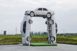 Homemade sculpture of three cars. Monument to the cyrillic letter P. Public Monument. Krasnodar,