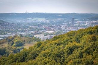 View of Jena city centre with the Jentower skyscraper, surrounded by forests and mountains, Jena,