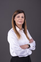 Elegant senior businesswoman with her arms crossed