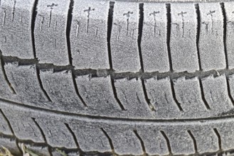 Hoarfrost on a rubber tire wheel. Morning frost
