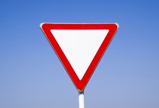 Road signs, give way. Sign on a blue background. Krasnodar, Russia