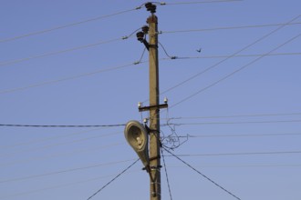 Power line post with a street lighting lamp. Krasnodar, Russia