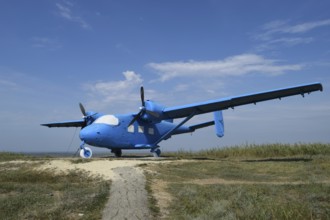 Blue rotary-wing aircraft on the hill. Taman, Krasnodar Krai, Russia
