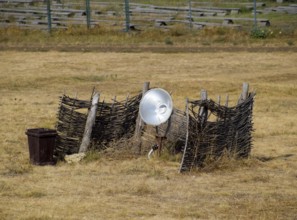 Lamp with a searchlight on the lawn for lighting a high object. Taman, Krasnodar Krai, Russia