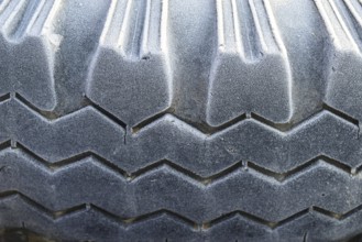 Hoarfrost on a rubber tire wheel. Krasnodar, Russia