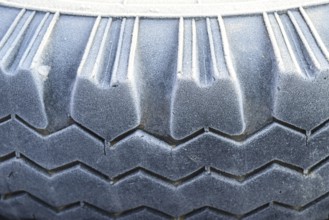 Hoarfrost on a rubber tire wheel. Krasnodar, Russia