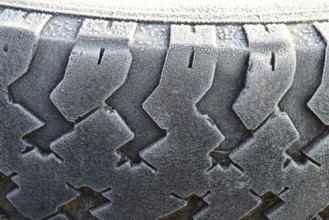 Hoarfrost on a rubber tire wheel. Krasnodar, Russia
