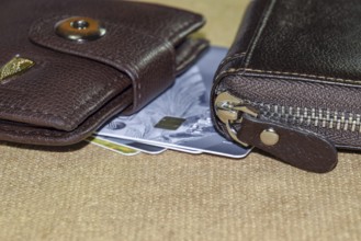 Brown leather wallet with credit and discount cards. Krasnodar, Russia