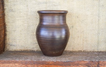 Clay pot on a shelf. Taman, Krasnodar Krai, Russia