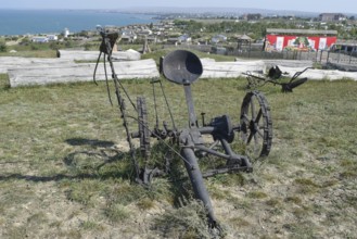 The exhibit of the old plow on the grass. Taman, Krasnodar Krai, Russia