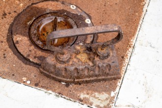An ancient iron iron on the stove. Taman, Krasnodar Krai, Russia