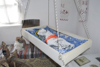 Cradle with dolls in the bedroom. Taman, Krasnodar Krai, Russia